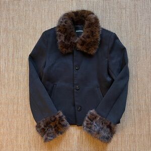 Collared Jacket in black with fur details around neck and waist